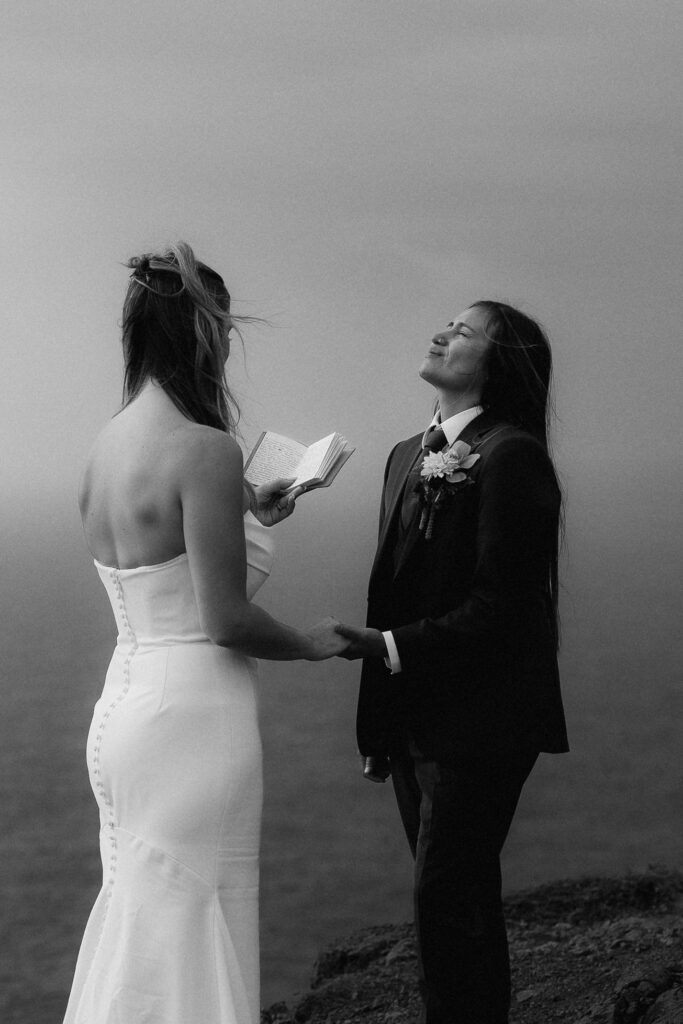 Couple exchanging vows during a cliffside elopement ceremony in Madeira, Portugal