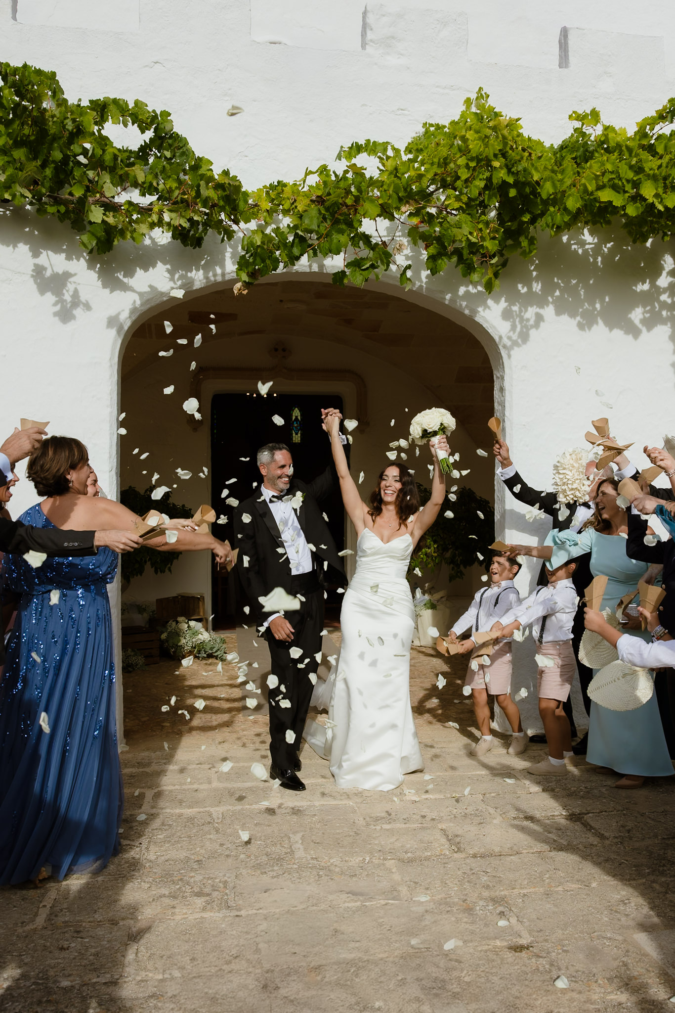 Bride and groom celebrating with guests after their wedding ceremony in Menorca, Spain